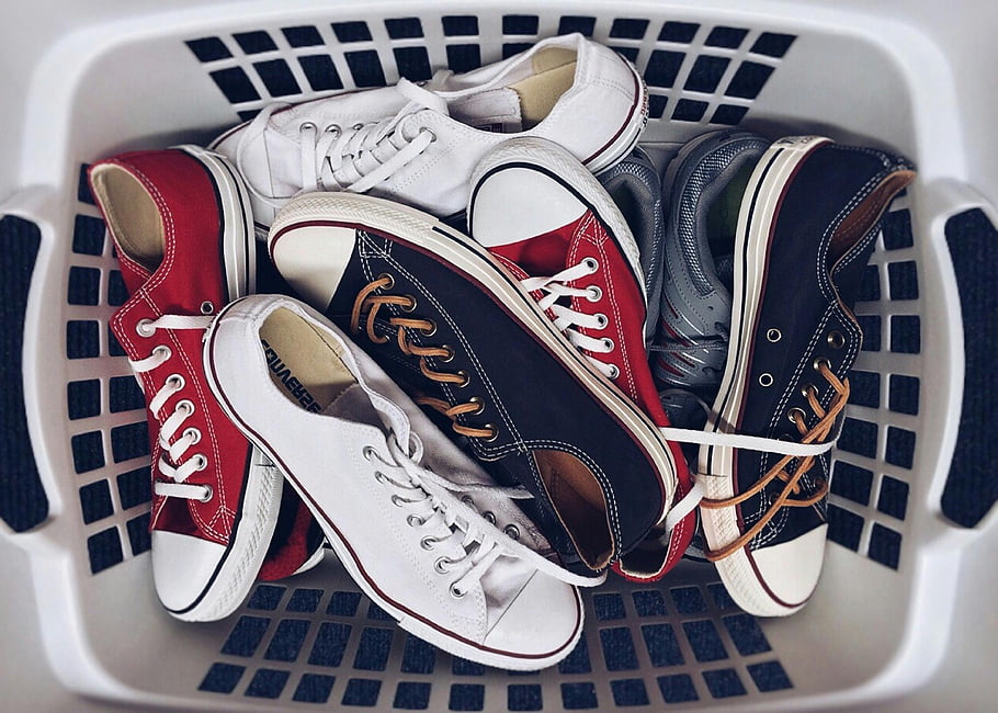 vintage-sneakers-unpaired-sneakers-laundry-basket-assorted-sneakers-style-and-nostalgia-white-sneakers-red-sneakers-black-sneakers-casual-footwear-retro-shoes